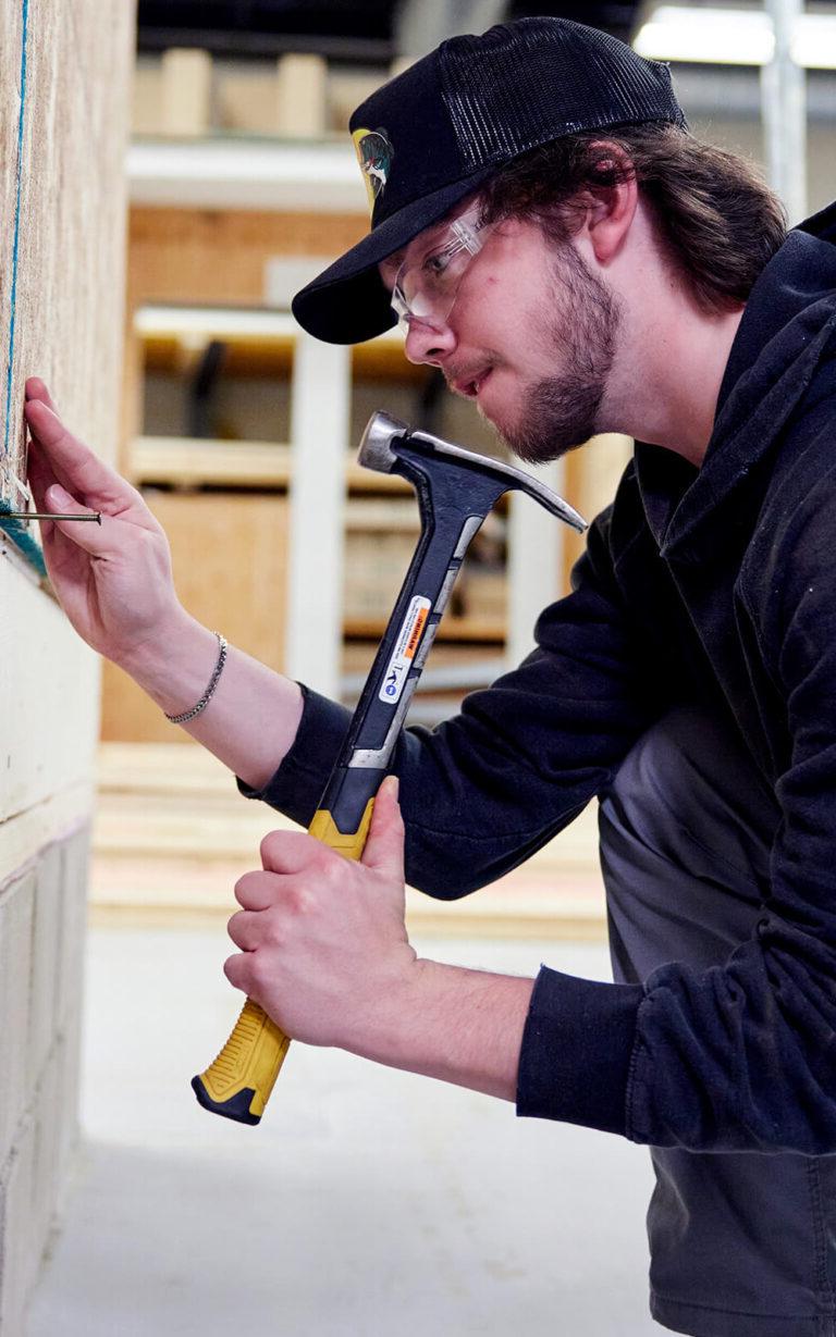 Photo of a student in the carpentry program.